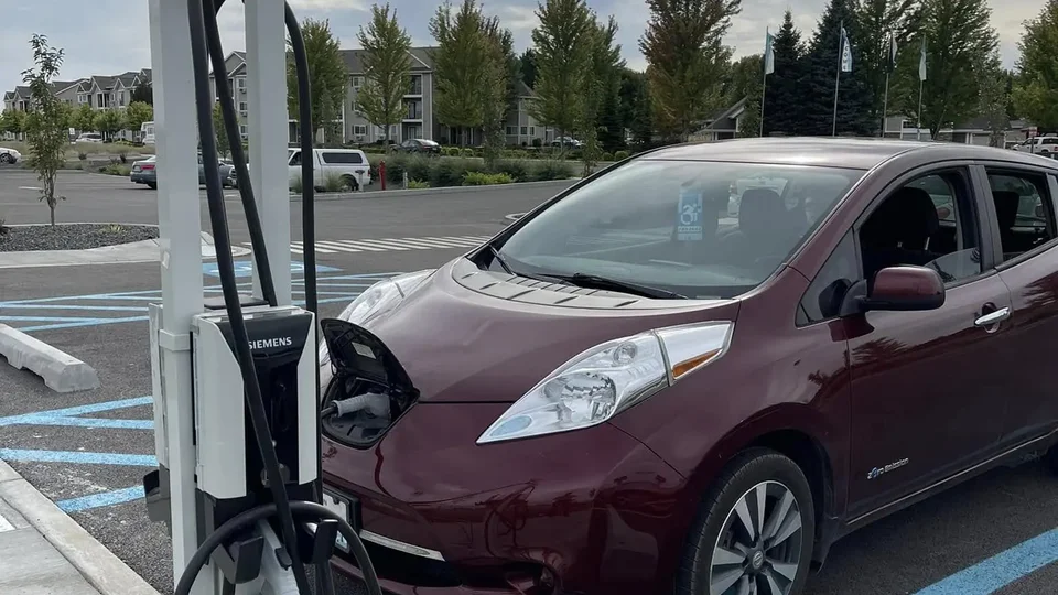 Master electrician upgrading workshop 240V welder outlet to code-compliant industrial EV charger receptacle