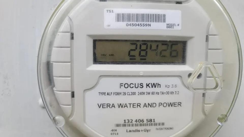 Two-pole 50A GFCI circuit breaker with white test button installed in service panel