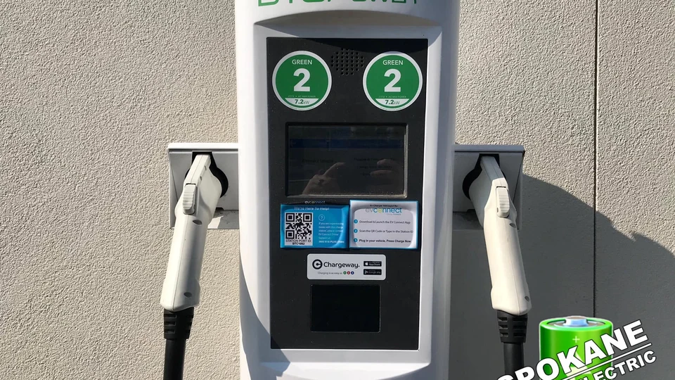 Licensed commercial electrical contractor installing dual-port commercial EV charging pedestals in Spokane WA