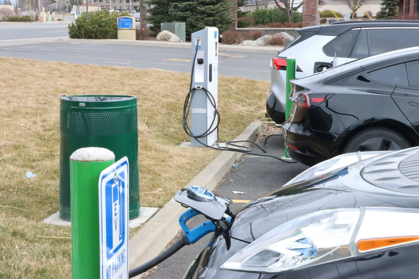 Licensed electrician installing hardwired Level 2 home EV charger station in Spokane WA